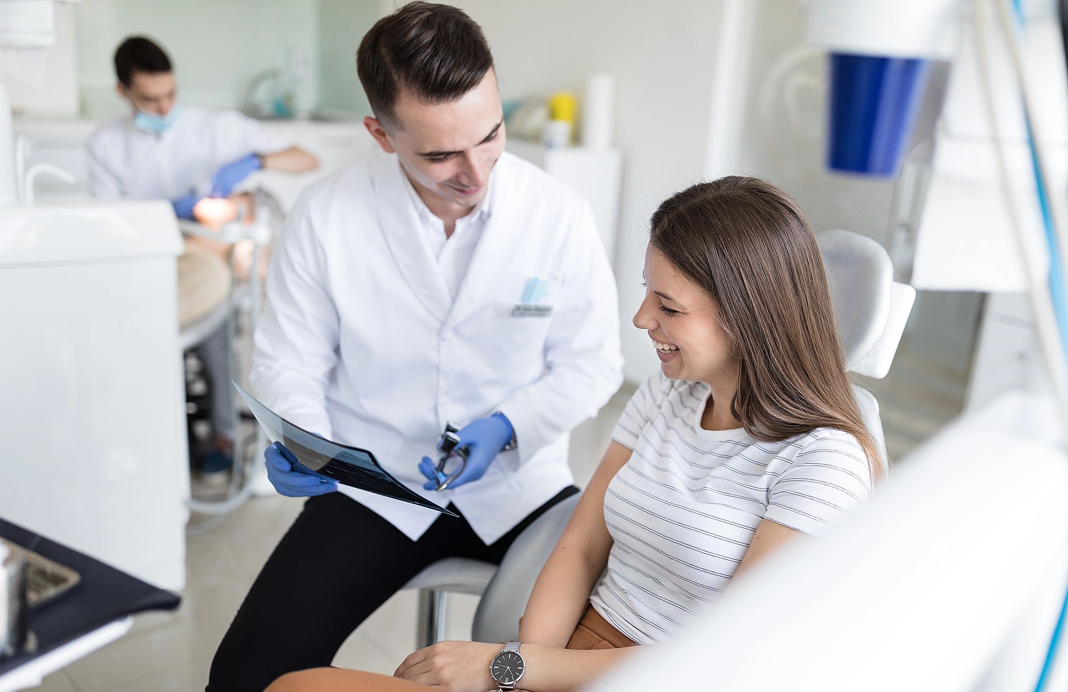 Dentist explaining treatment options to a patient