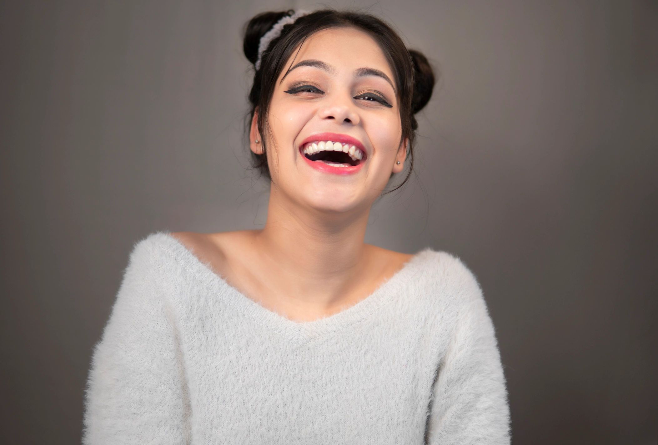 Smiling woman representing cosmetic dentistry confidence
