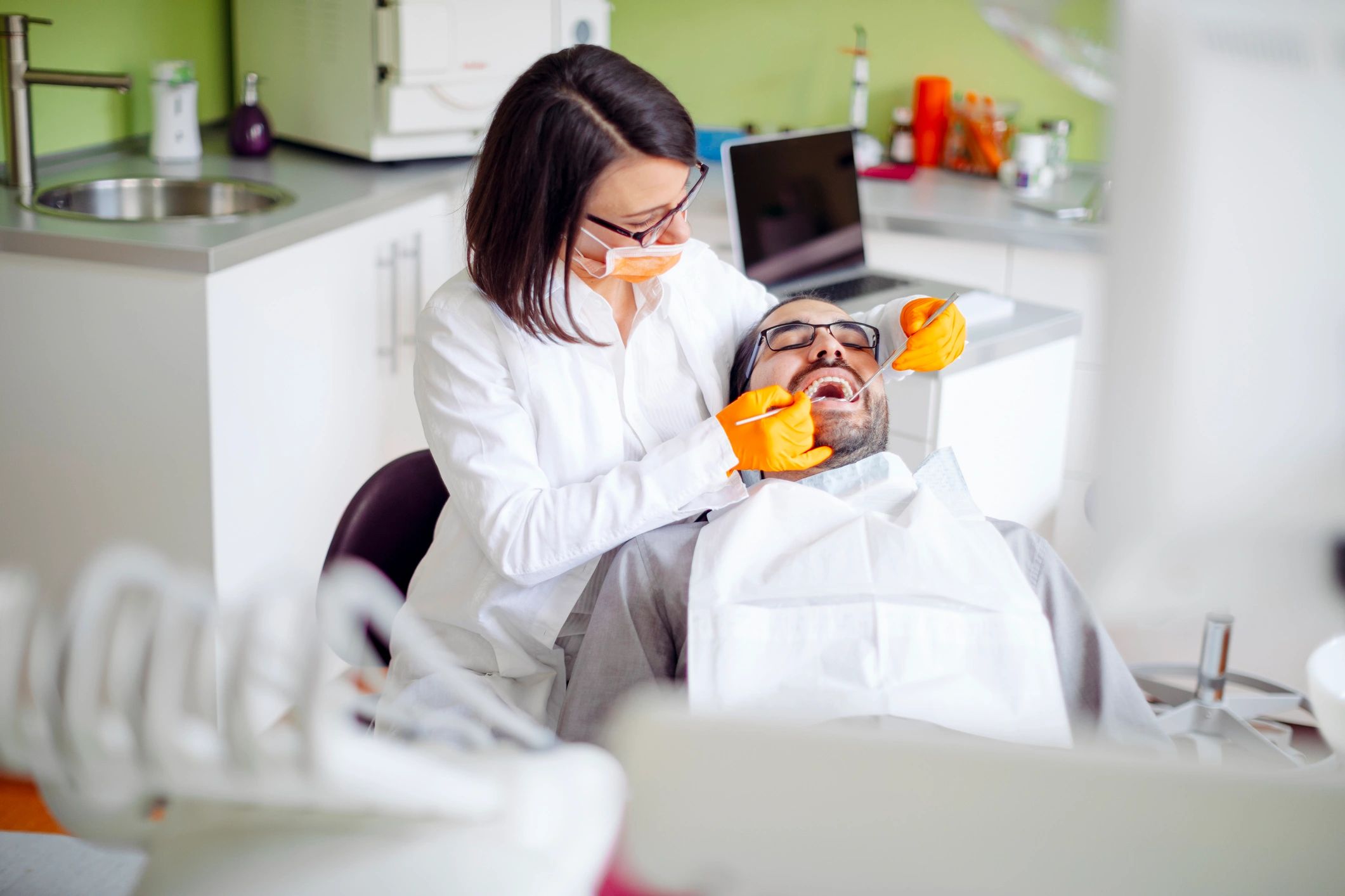 Dentist consulting a patient in a calm clinic setting
