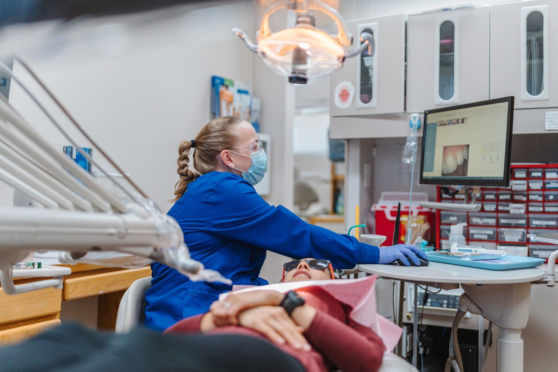 Dentist reviewing dental images during a patient appointment
