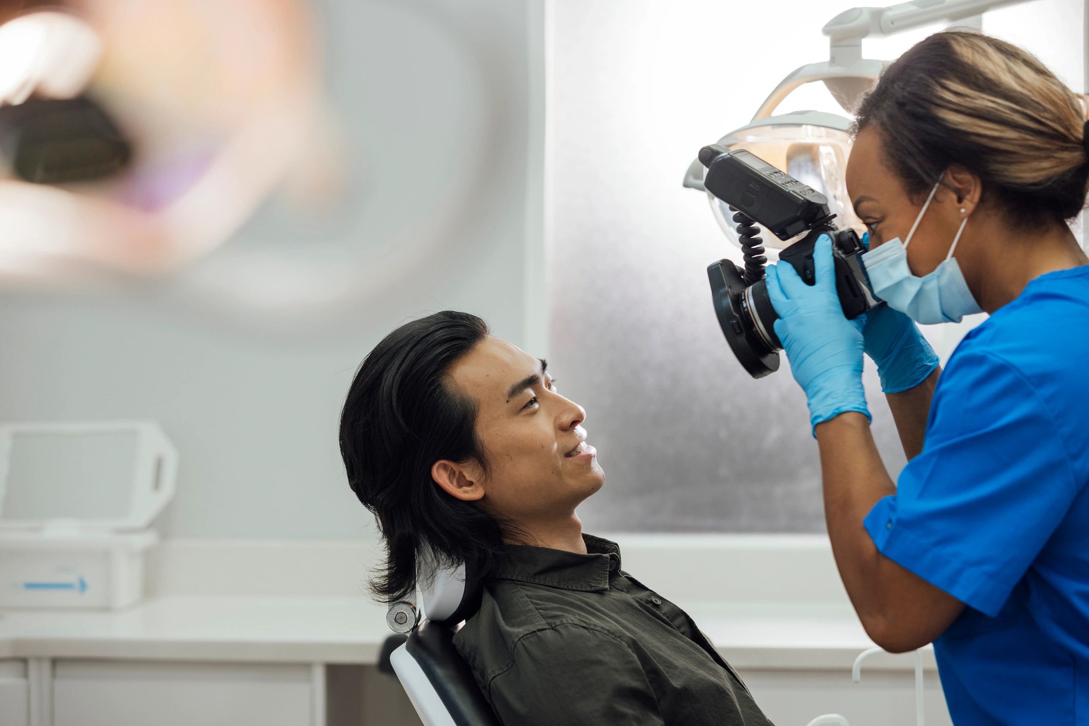 Orthodontist photographing aligner treatment progress