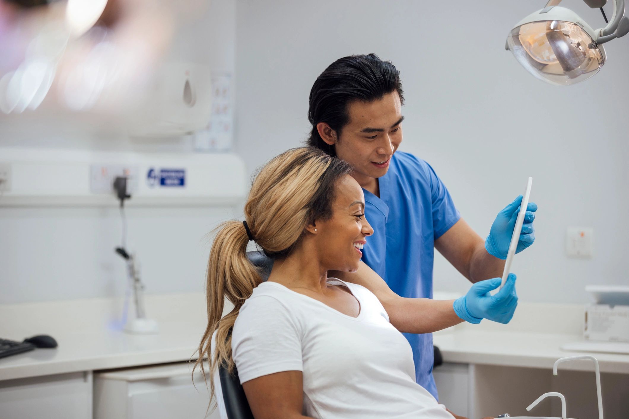 Dentist consulting with a patient in a clinic