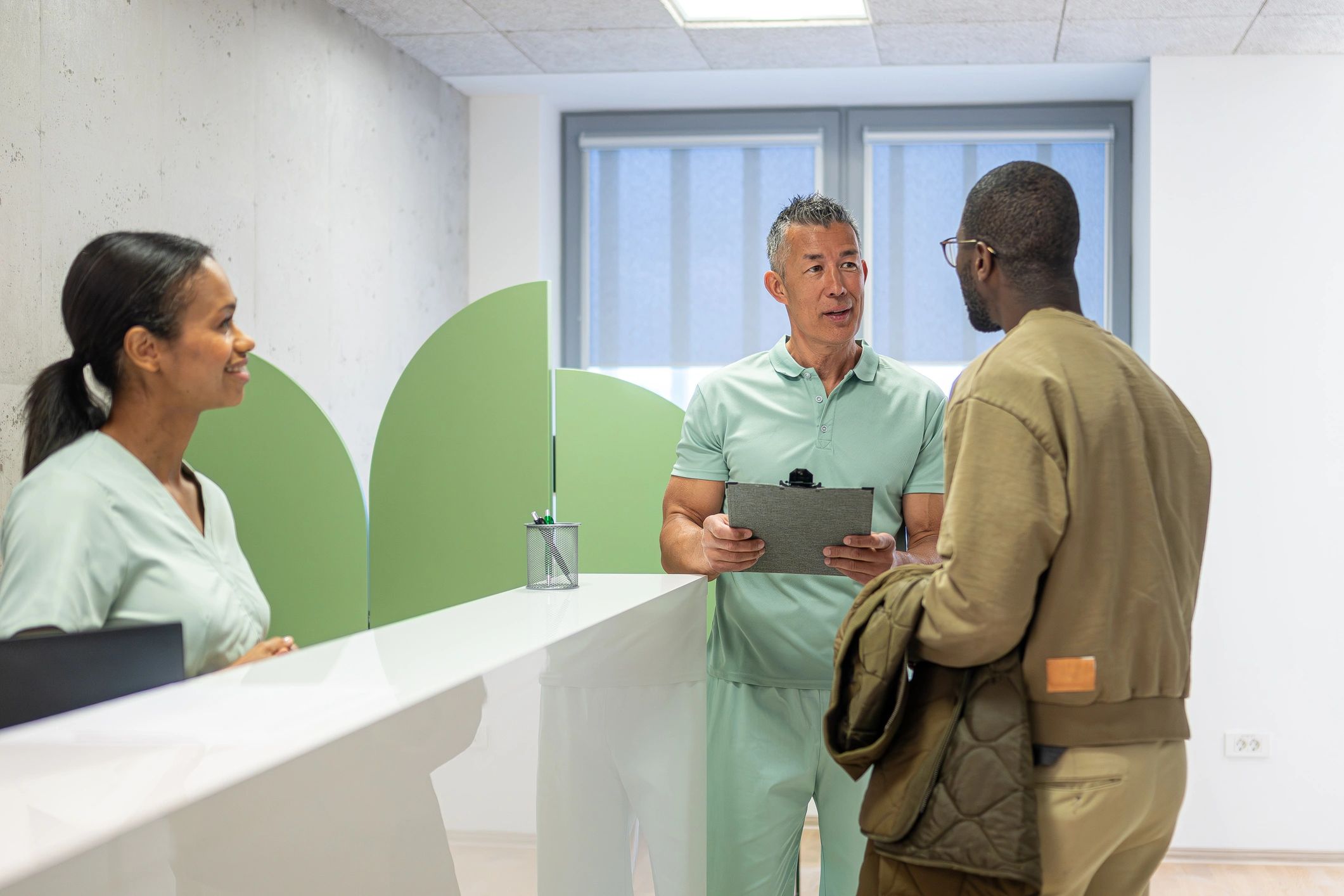 Patient speaking with healthcare professional in clinic